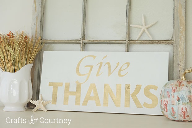 DIY Give Thanks Fall Sign by Crafts by Courtney | The perfect addition to a fall mantel display, especially one of the coastal variety!  Courtney offers great tips on how to use a craft-cutter and some paint to transform a plain wood board into an inspirational work of art.