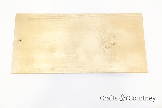 DIY Give Thanks Fall Sign by Crafts by Courtney | Spray painting the wood.
