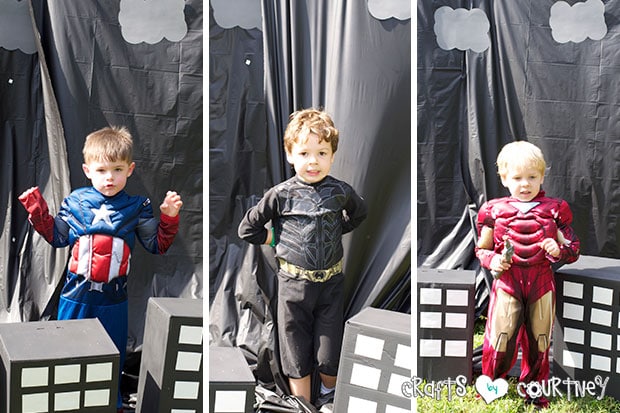 Superhero Birthday Party: Danger Room: Obstacle Course: Posing in front of Superhero backdrop
