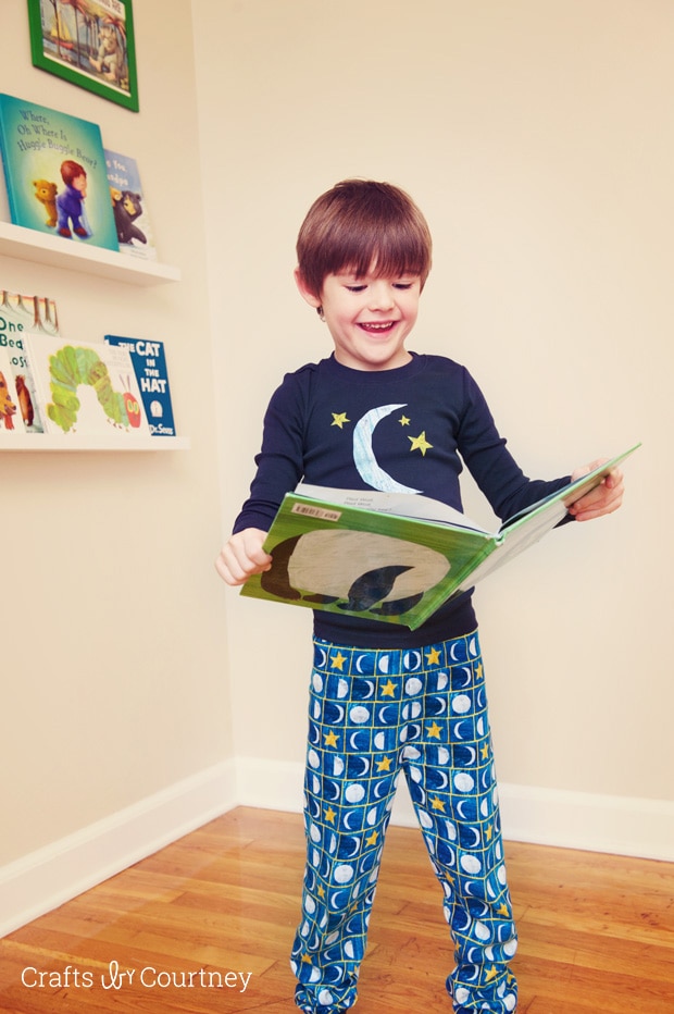 Picking out our books in our Gymboree Eric Carle sleepwear