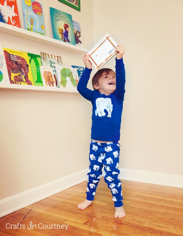 Picking out our books in our Gymboree Eric Carle sleepwear